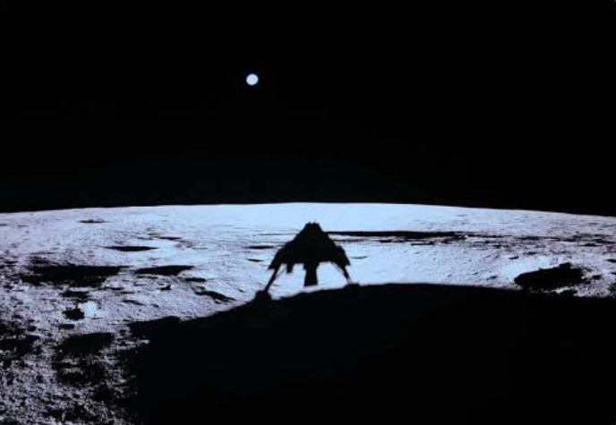 The Blue Ghost lander on the lunar surface with Earth in the black sky